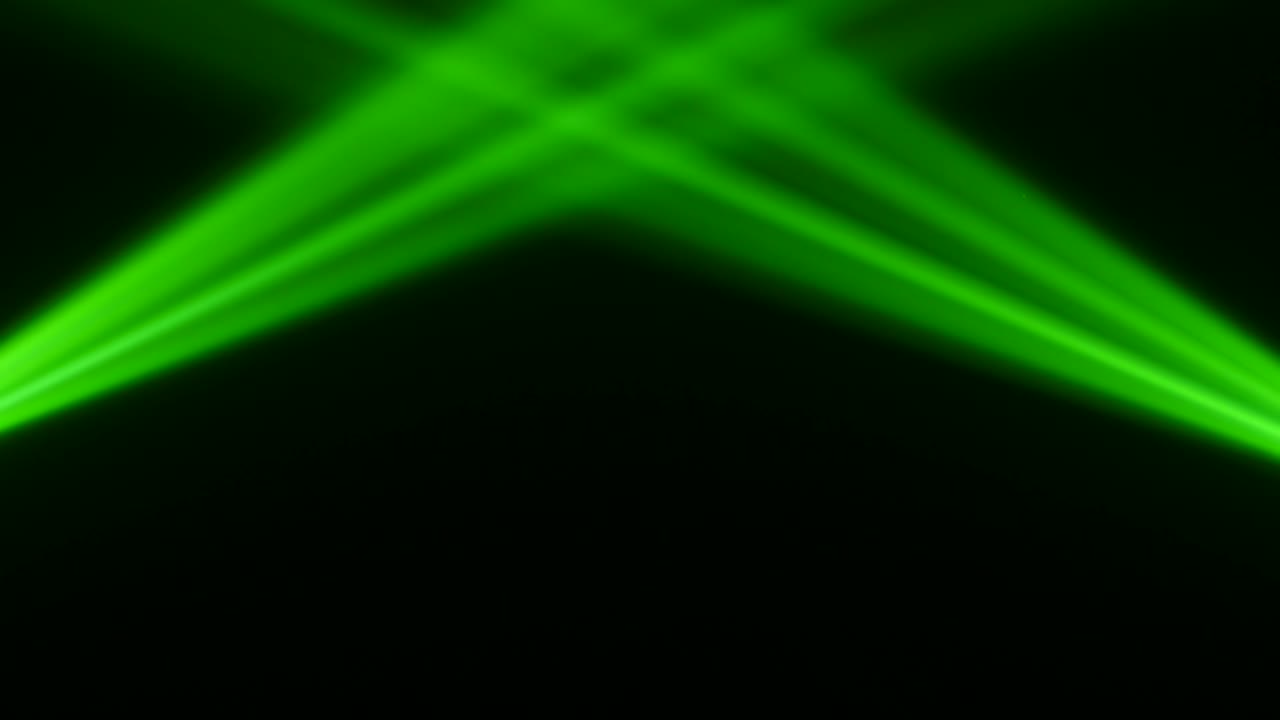 Multicolored rays from the light of the lanterns intersect each other. Black background