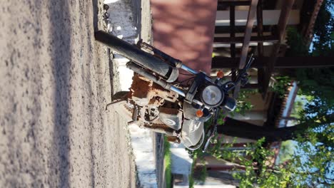 dirty old motorcycle parking on the street of an old town
