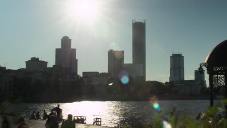 cityscape with skyscrapers and river