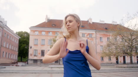 beautiful woman dancing alone in a public square 2