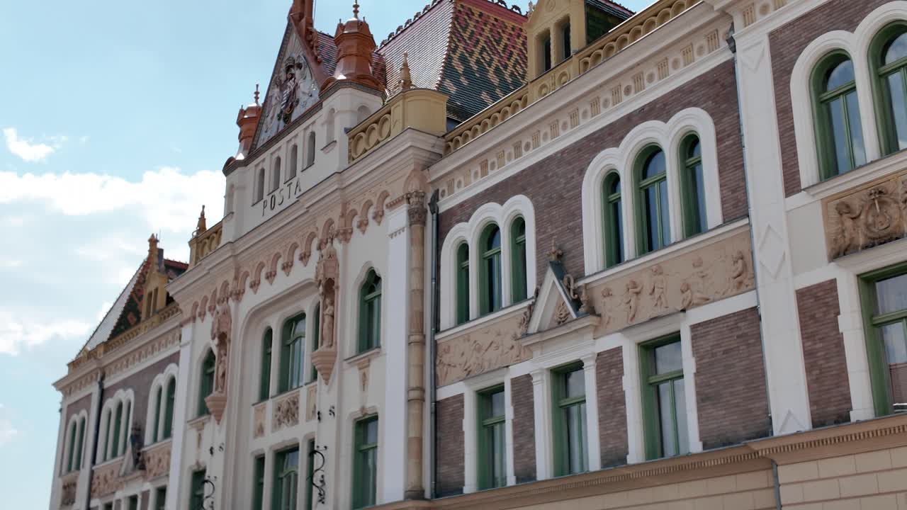 Smooth pan across the historic Post Office in Pécs, highlighting its facade and architectural details
