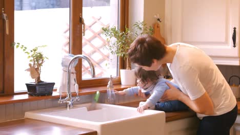 mother playing with her baby