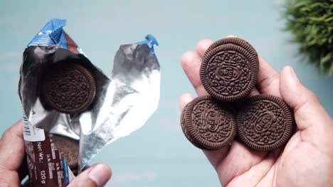 oreo cookies in hand