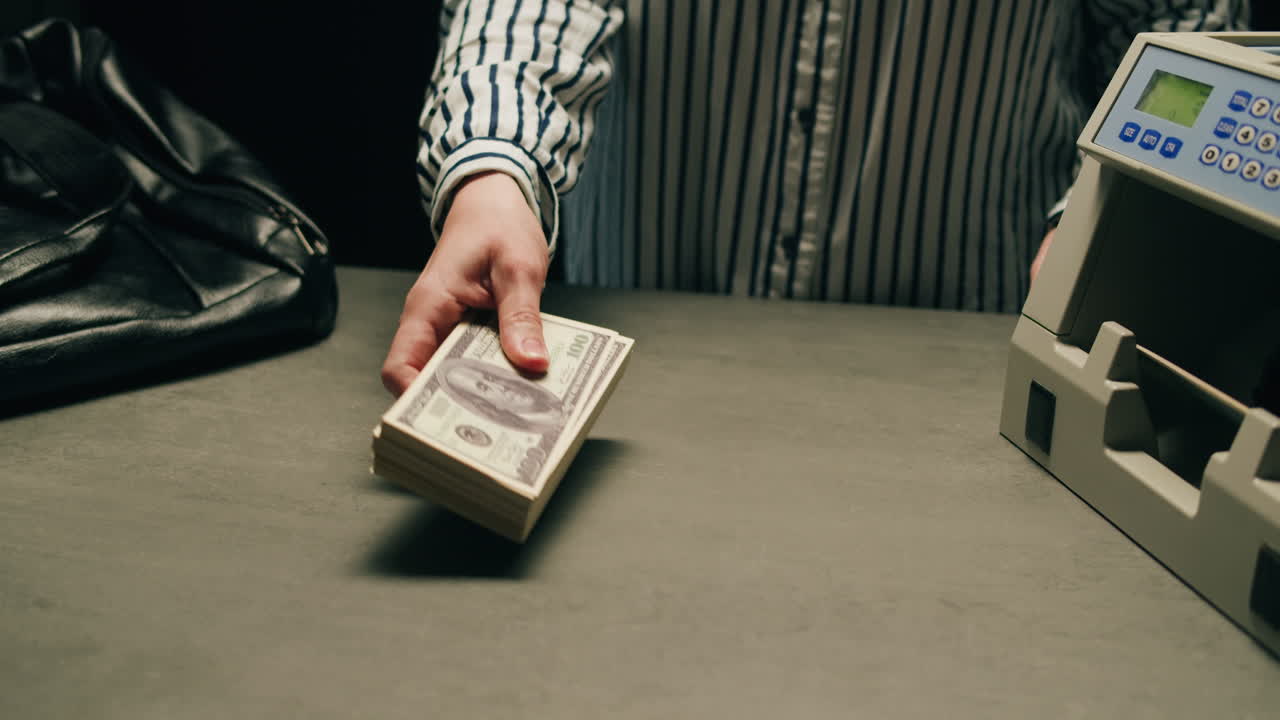 Specialised police officer Counting dollar banknotes in crime lab, conceptual image. High quality 4k footage