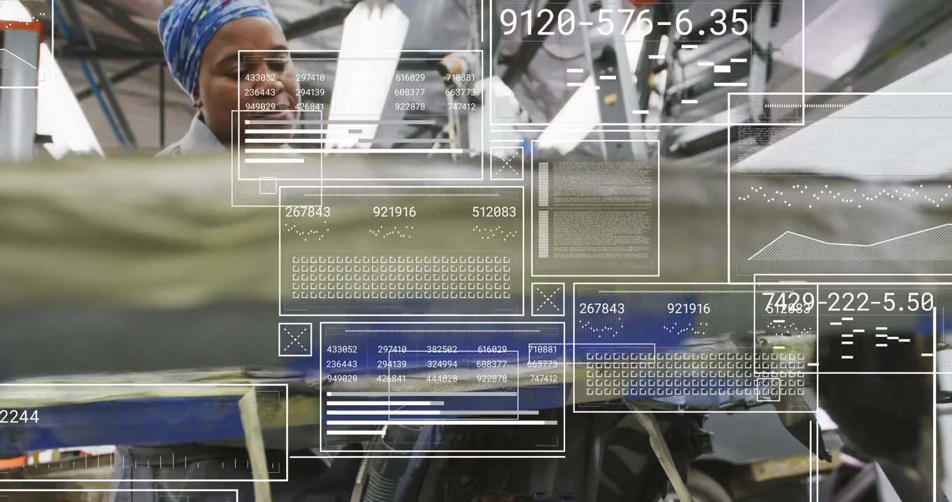 Operating worker wearing gray jacket blue scarf smoothing panel with iron at factory, data overlays