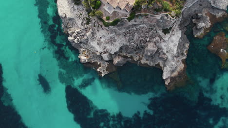 Aerial-View-of-Coastal-Rock-Formation-in-Cala-Llombards,-Mallorca,-Spain