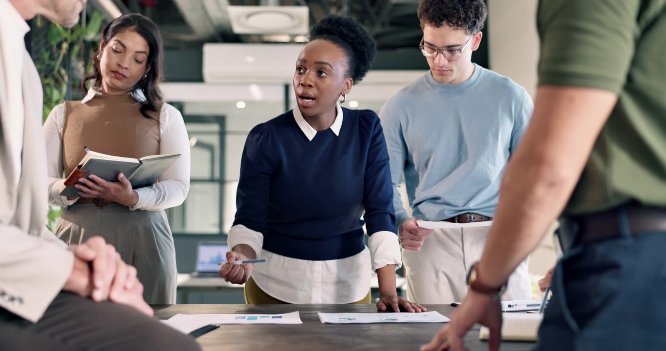 Diverse Business Team Collaborating in Modern Office Meeting