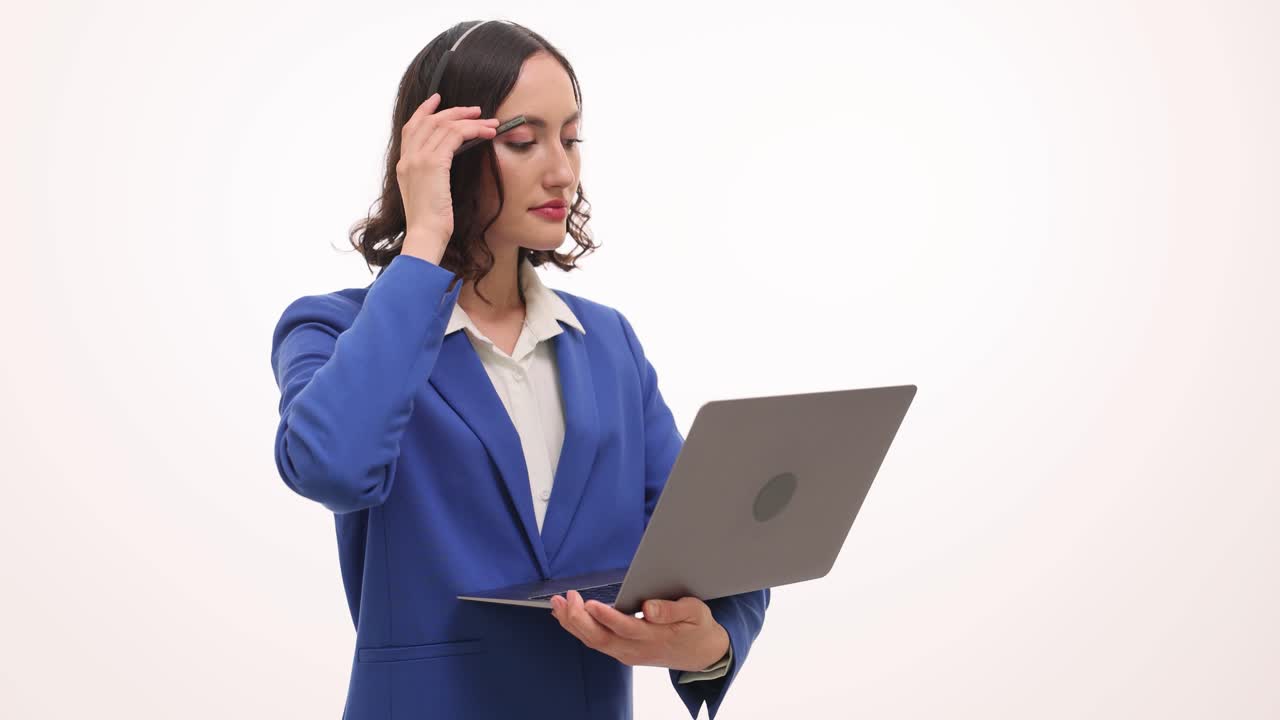 Businesswoman with headset using laptop