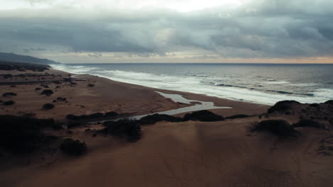 sunset after a storm on the sea in piscinas, sardinia