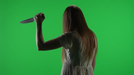 medium half turn green screen chroma key video of a posessed female figure ghost poltergeist zombie