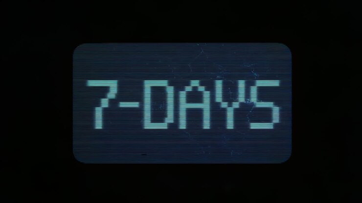Opening closeup panel showing pixelated cyan 7-DAYS over bluish backdrop, flickering with scanlines