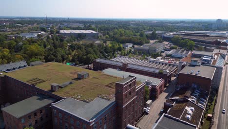 leipzig cotton spinning mill factory industrial architecture, characterized by brick buildings and a chimney