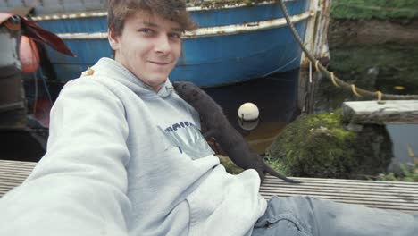 incredible shot wild mink stands on chest of young man