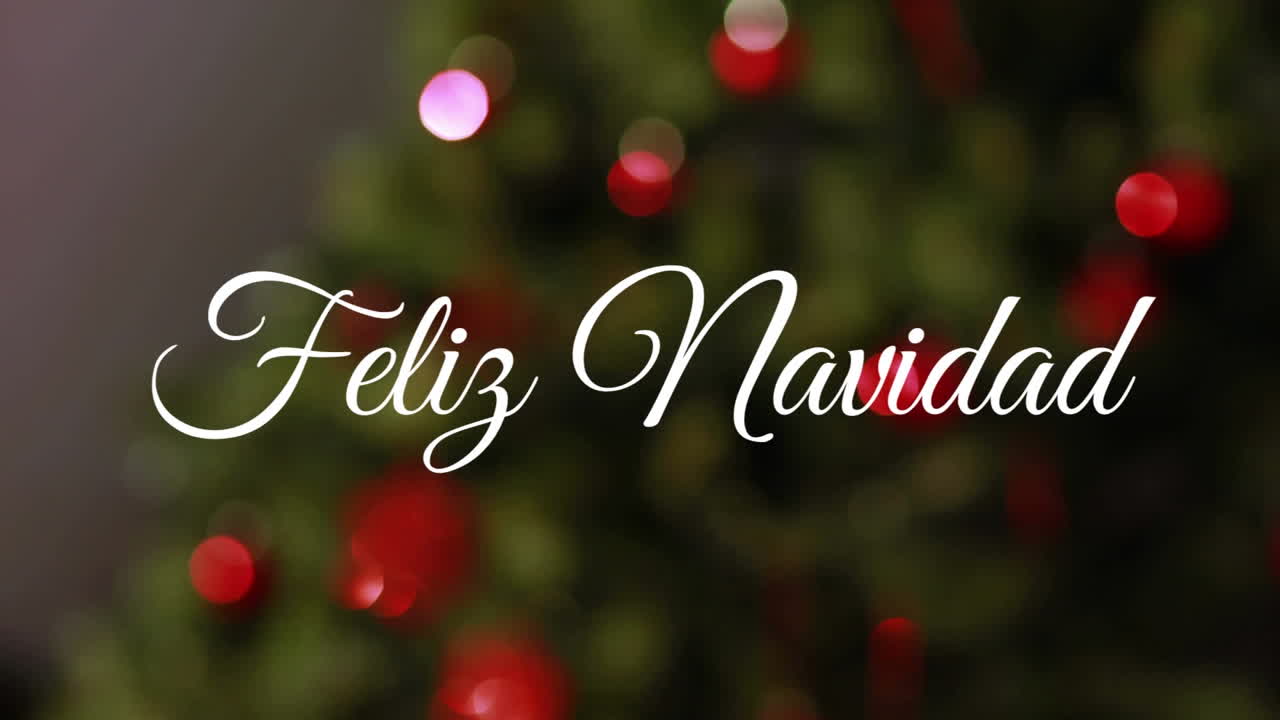 animación de saludos navideños españoles sobre el árbol de navidad