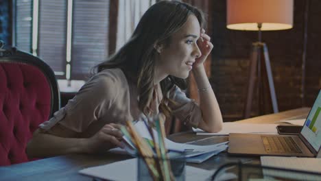 happy woman reading good news on laptop in home office. successful businesswoman