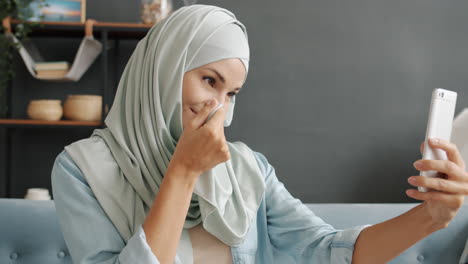 Woman taking a selfie in hijab