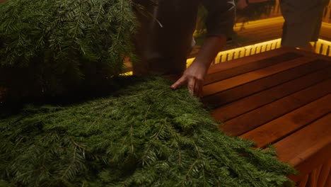 preparing a sauna with fir branches