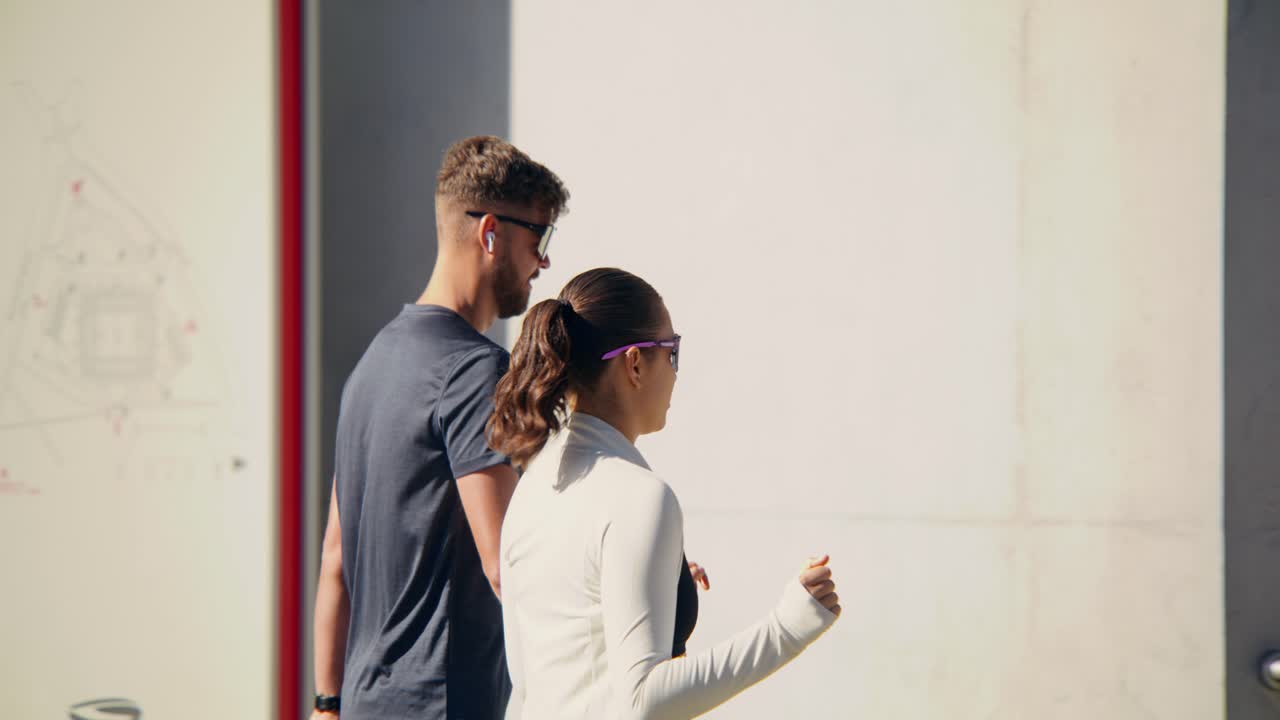 Couple Walking Outdoors in Activewear