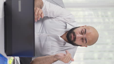 Vertical-video-of-Home-office-worker-man-has-eye-pain.