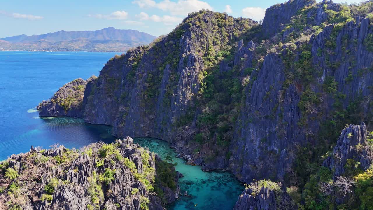 Drone footage of cliffs and lagoons on Coron island in the Philippines