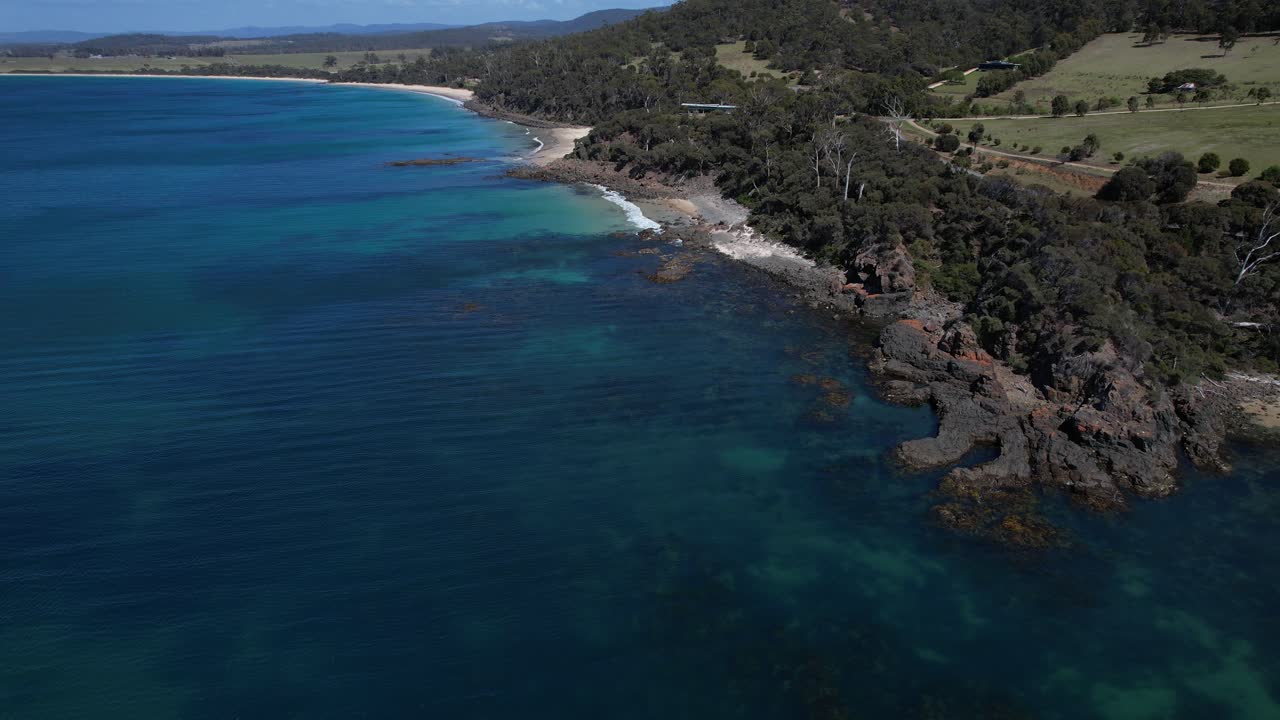 Mayfield Beach With Rocky Coast In Tasmania, Australia - Aerial Pullback