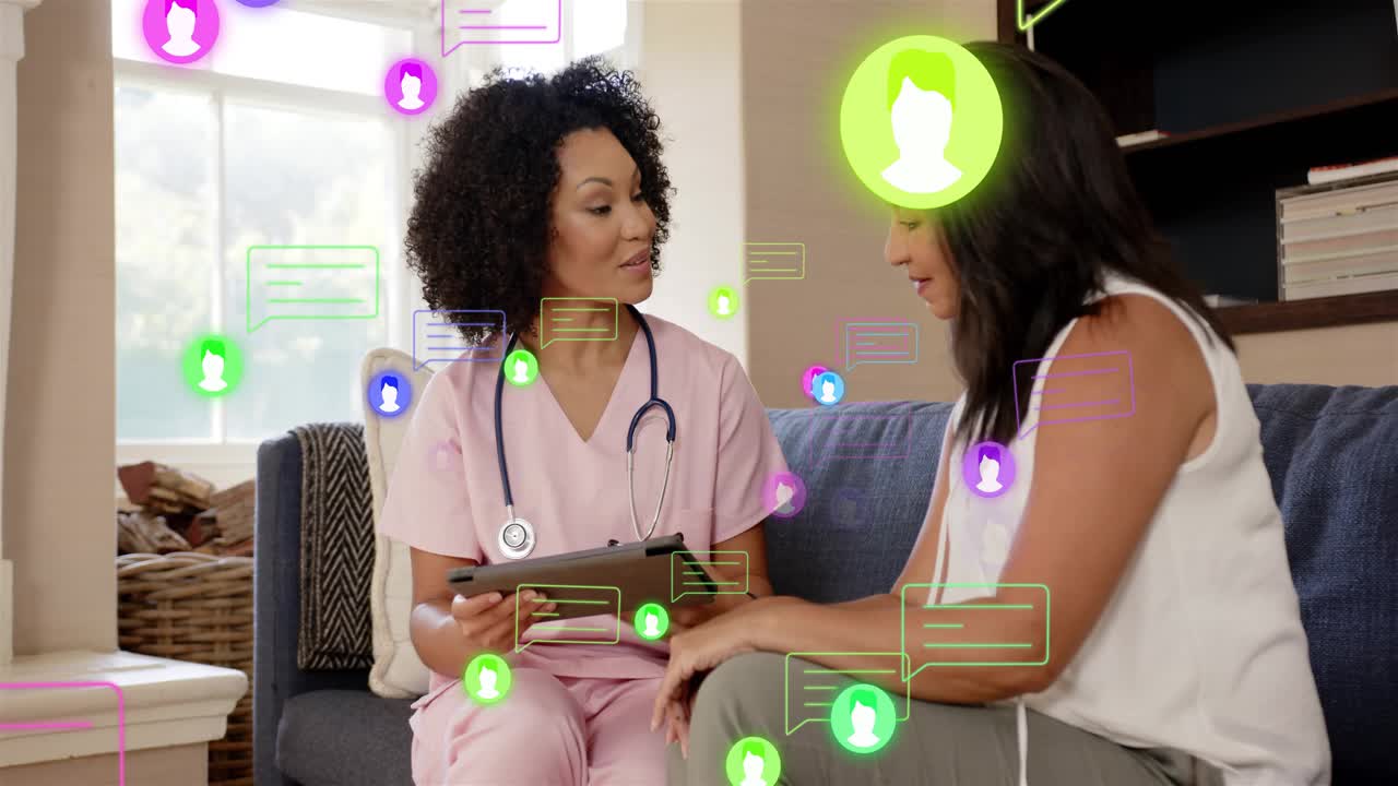 Nurse tapping tablet reviewing and initiating animated messages moving, patient nodding during care