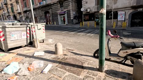 scooter and trash bins on a naples street