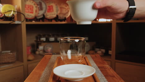 pouring tea during a traditional tea ceremony