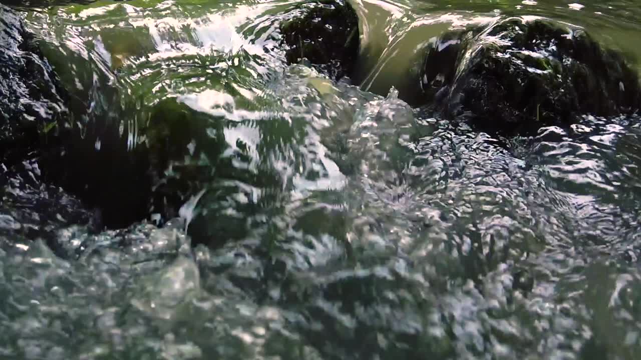 View of water pouring in a small waterfall