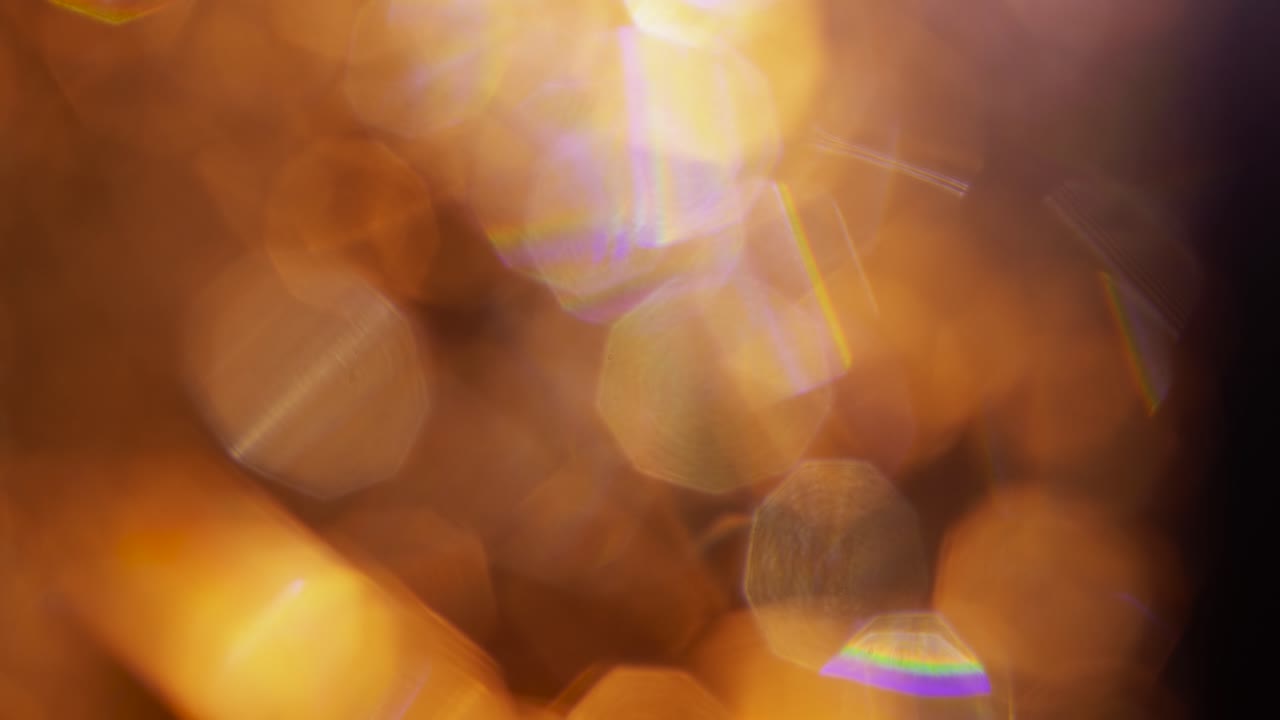 Warm Shimmering Bokeh Lights and Lens Flares Background
