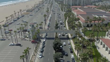 drone flying away from huntington beach cross walk on pch
