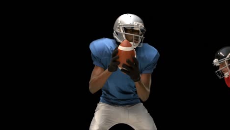 serious american football player tackling for ball