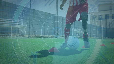 escáner de alcance sobre la sección baja de entrenamiento de jugador de fútbol masculino en el campo de hierba