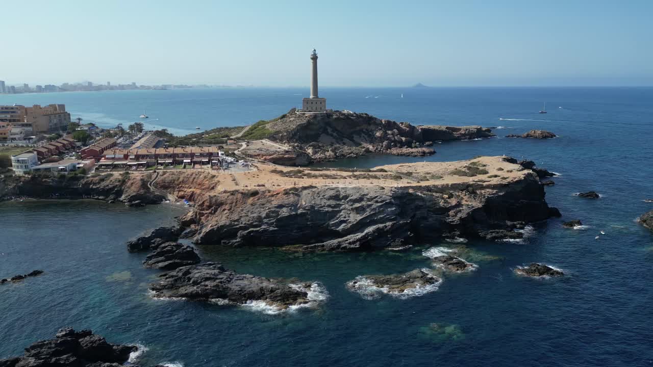 A sweeping drone captures cinematic, panoramic views of the city, showcasing its lighthouse and the expansive Mediterranean Sea.