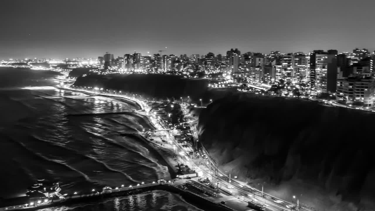 Aerial night shots with drone, hyperlapse in black - white on the Costa Verde in Miraflores Lima Peru in 4K