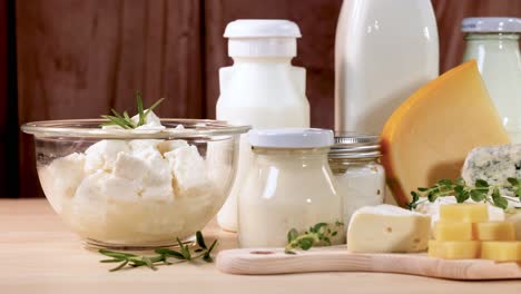 assorted dairy items arranged on a wooden surface