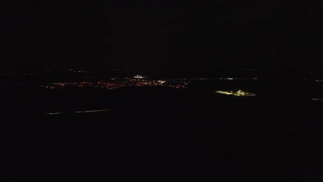 a nighttime oil drilling station fire department operation - aerial drone shot