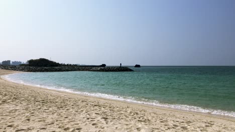 Small-Waves-Rolling-Into-Shore-at-Araha-Beach,-Okinawa,-Japan