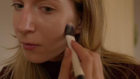 Girl-doing-makeup-on-herself-at-home