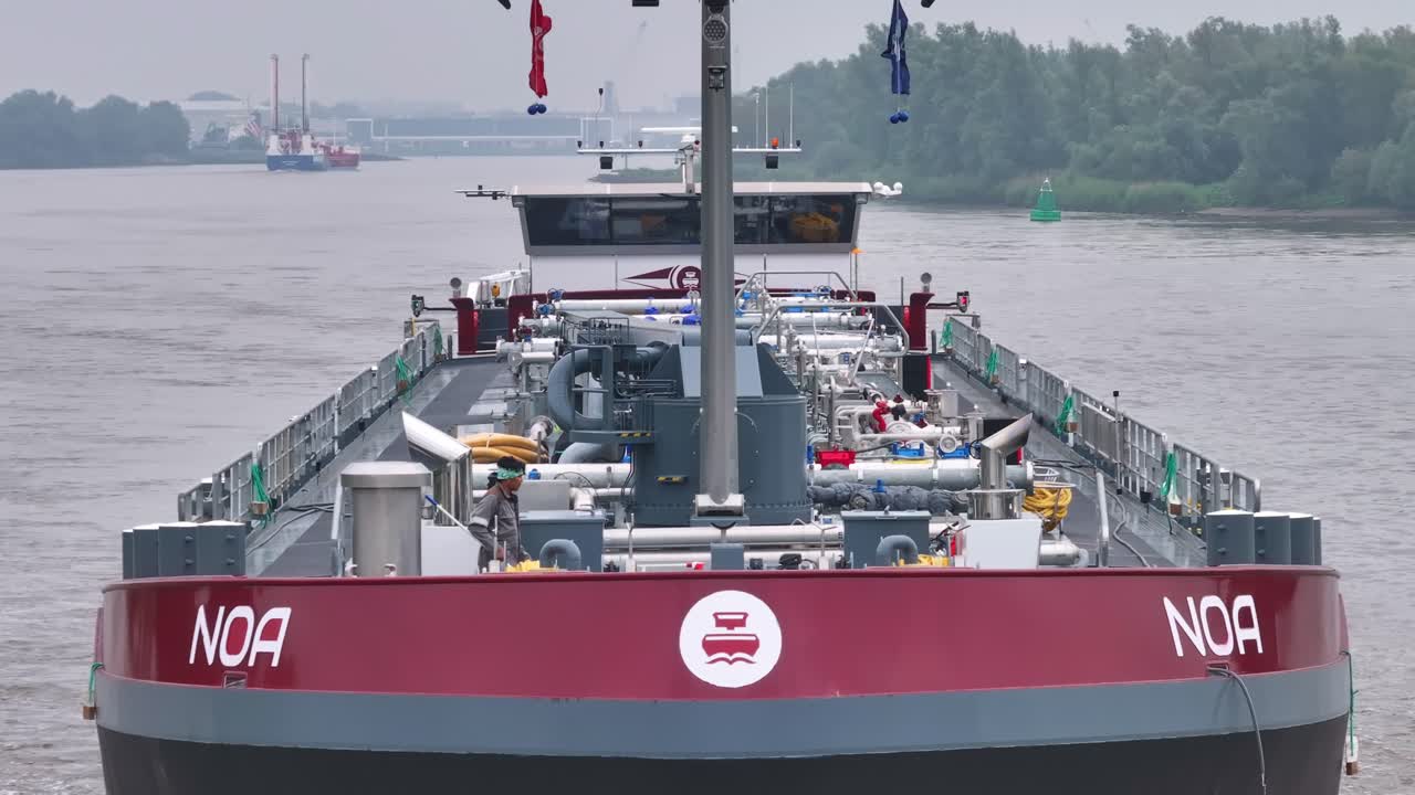 Stern view of the cargo ship NOA on a river
