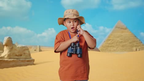 child explorer on phone in egyptian desert