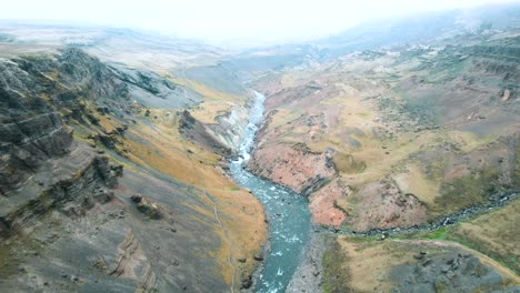 Haifoss-waterfall-valley-in-the-volcanic-fields,-Iceland,-Drone-shot