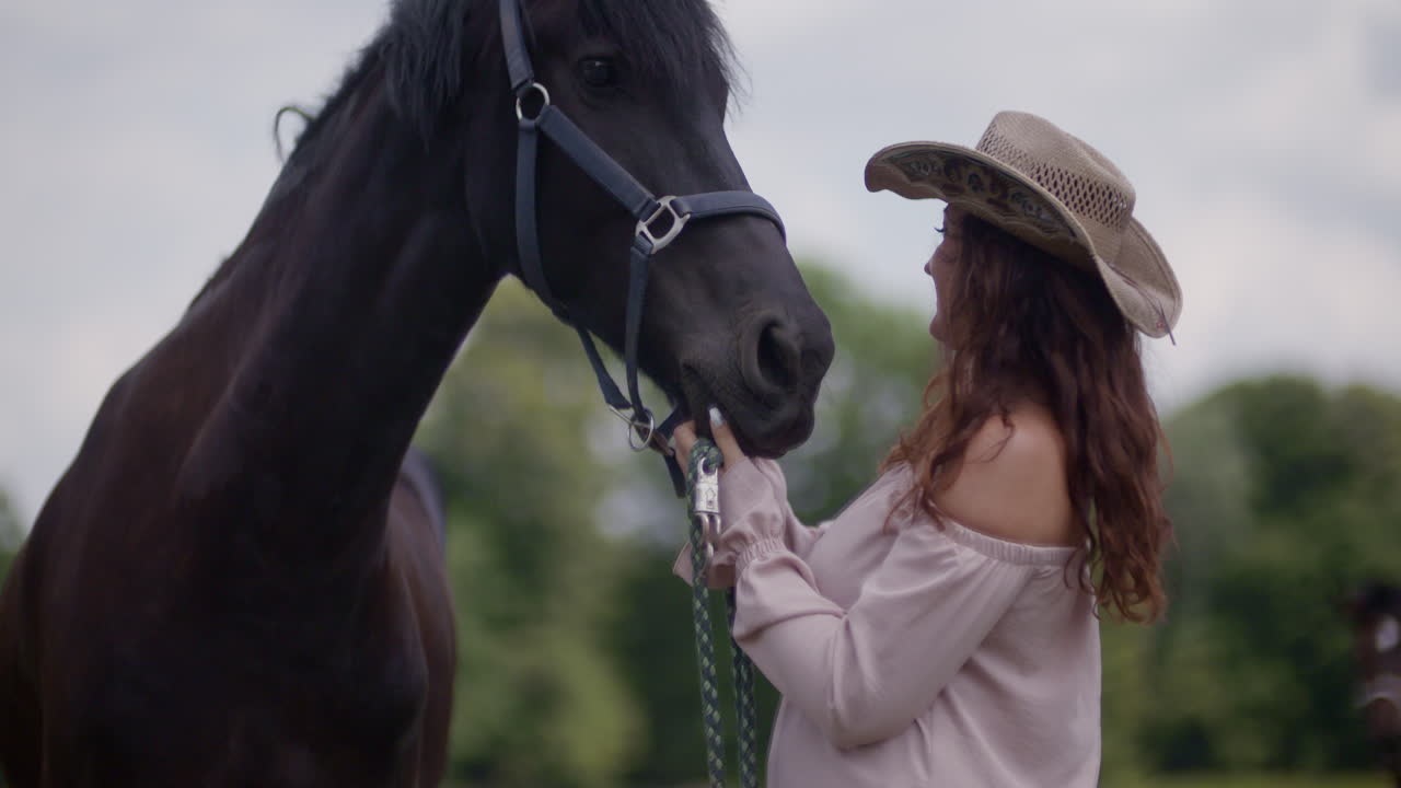 Woman with a black horse