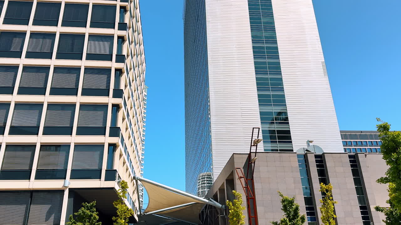 Multi-storied diverse buildings in the urban city. High-rise buildings at the backdrop of blue sky. Bratislava, Slovakia