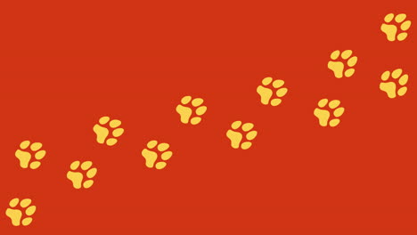 Animation:-Eine-Spur-Aus-Gelben-Fußabdrücken-Auf-Orangefarbenem-Hintergrund,-Ein-Hund,-Der-Alleine-Auf-Einem-Pfad-Geht,-Der-Von-Links-Nach-Rechts-Verläuft