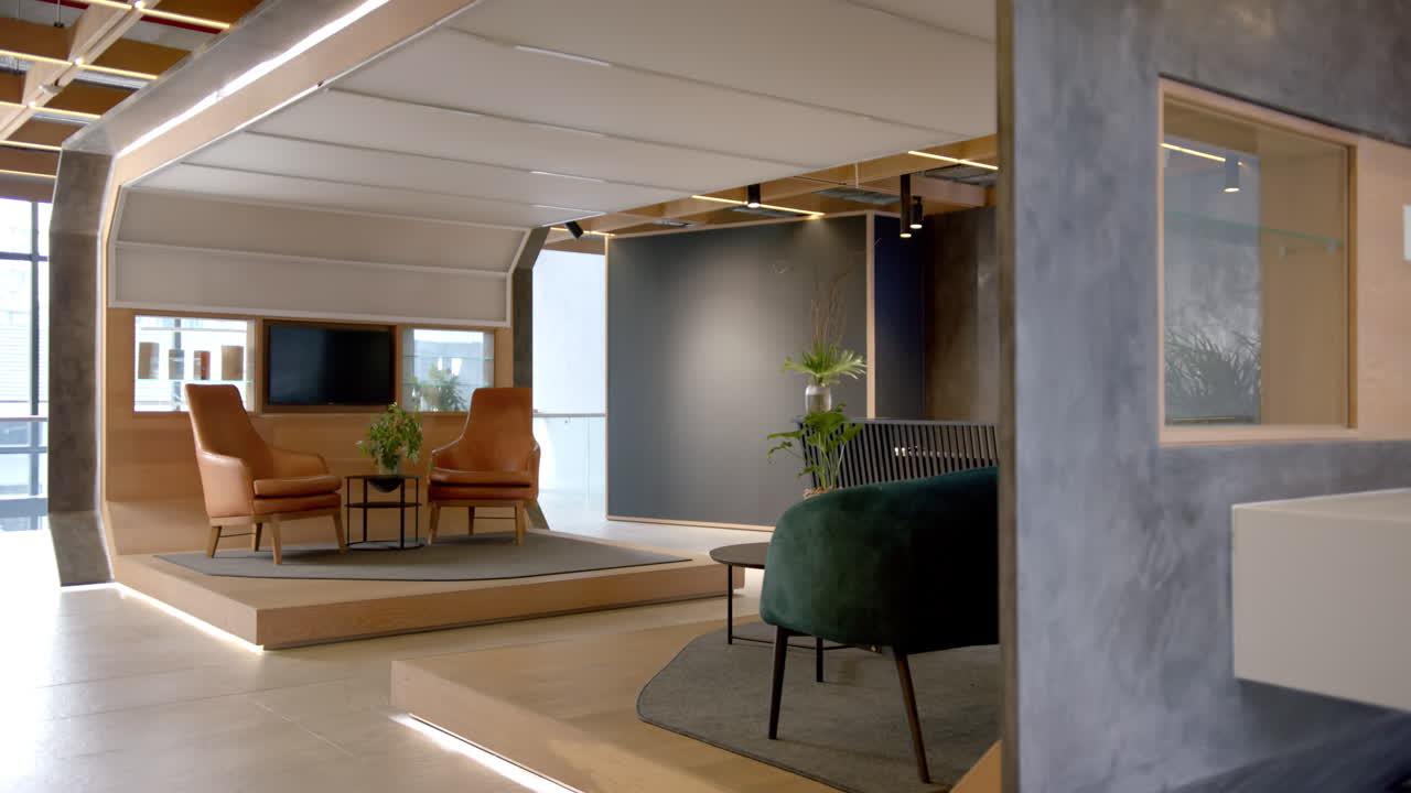 Modern office lounge area with stylish furniture and plants, creating inviting space, copy space