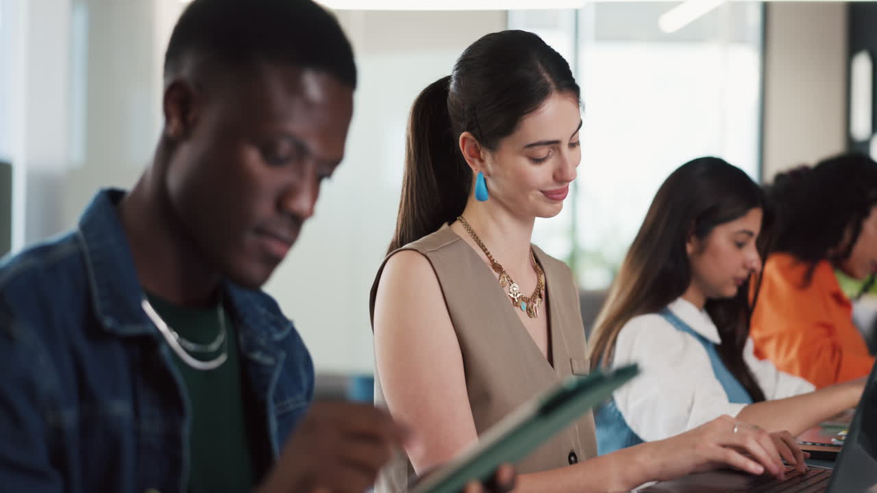 Diverse Young People Working and Studying in Modern Office