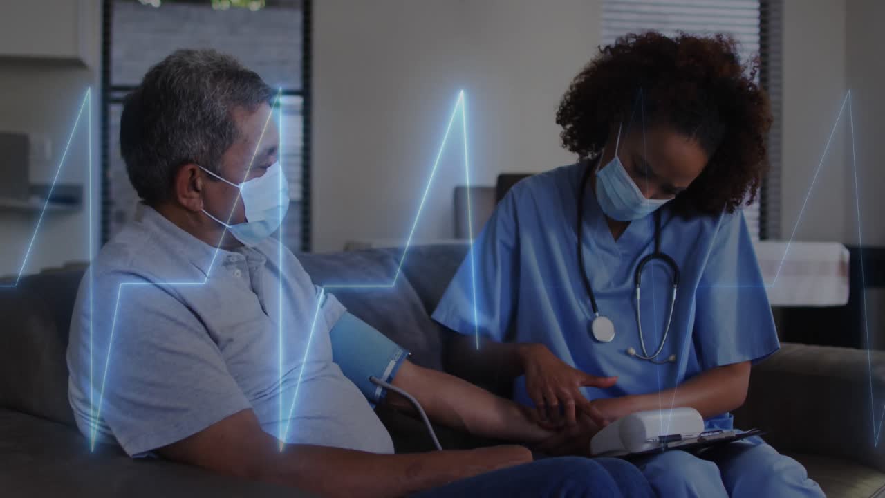 Animation of cardiogram over diverse doctor and patient measuring blood pressure