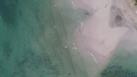 The-clear,-transparent-waves-rolling-to-the-beach-of-Thailand---aerial