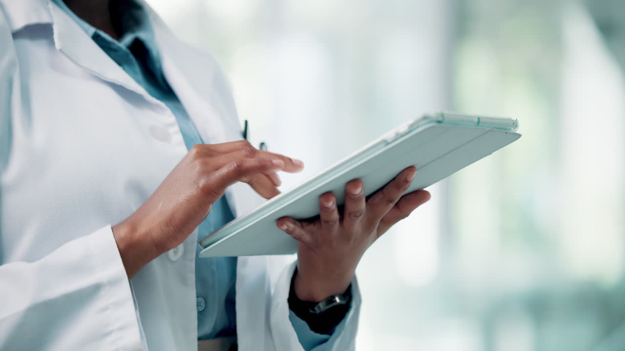 Medical Professional Using Digital Tablet in a Healthcare Setting